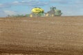 Farm equipment planting wheat in the fertile farm fields of Idaho. Royalty Free Stock Photo