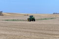 Farm field being sprayed in the spring