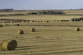 A Farm field in fall with bales of hay after the harvest Royalty Free Stock Photo