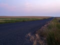 Farm fields by a road at sunset in rural Idaho Royalty Free Stock Photo