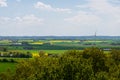 Farm fields of green and yellow canola in the flat farmland landscape of SkÃÂ¥ne Sweden during spring and summer Royalty Free Stock Photo