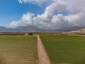 Farm fields with rows of green lettuce salad. Aerial view on agricultural valley Zafarraya with fertile soils for growing of Royalty Free Stock Photo