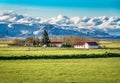 Farm at the foot of the huge glacier