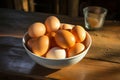 Farm Fresh Eggs in a bowl, displayed on a rustic wooden table Royalty Free Stock Photo