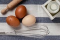 Farm fresh organic large brown and white eggs on a kitchen linen  on rustic dark oak wood background table. Royalty Free Stock Photo