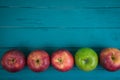 Farm fresh organic red and green apples on wooden table in paste Royalty Free Stock Photo