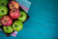 Farm fresh organic red and green apples on wooden table in paste Royalty Free Stock Photo