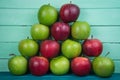 Farm fresh pyramid of organic red and green autumn apples on woo Royalty Free Stock Photo