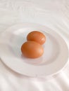Farm Fresh - Two Eggs Nestled on a Plate