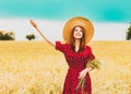 Farm girl holding wheat ears on a field Royalty Free Stock Photo