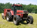 Farm: haymaking tractor and baler Royalty Free Stock Photo