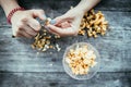 Farm holidays: Woman is preparing delicious chanterelle mushrooms on an old rustic wooden table