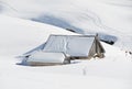 Farm house buried under snow