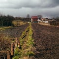 A farm house on the country side. road to a farmhouse in a dug-out land