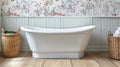 Farm house interior design of bathroom with a white freestanding bathtub, grey wainscoting, floral wallpaper, wicker baskets, and Royalty Free Stock Photo