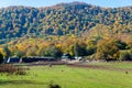 Farm house near mountain under blue sky Royalty Free Stock Photo