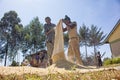 Workers shelling maize in Western Kenya