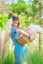 Farm lady Woman carrying a basket walking in agricultural field for carefree and healthy nature lifestyle concept