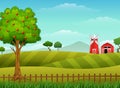 Farm landscape with shed and red windmill Royalty Free Stock Photo