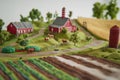 farm landscape with three-dimensional elements, rural landscape with farm fields and domestic animals Royalty Free Stock Photo