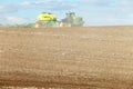 Farm equipment planting wheat in the fertile farm fields of Idaho. Royalty Free Stock Photo