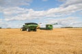 Farm machinery in a harvested grain field