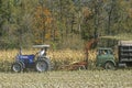 Farm machinery harvesting corn
