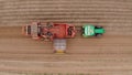 Farm machinery harvesting potatoes. Farmer field with a potato crop. Royalty Free Stock Photo