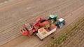 Farm machinery harvesting potatoes. Farmer field with a potato crop. Royalty Free Stock Photo