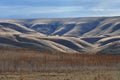 Farm Nestled Among Dry Rolling Hills Royalty Free Stock Photo