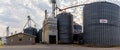 Farm produce storage system. A modern community grain elevator with a weigh station Royalty Free Stock Photo