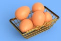 Farm raw organic brown eggs for morning breakfast in metal wire basket Royalty Free Stock Photo
