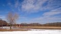 Farm with red barn on a winter day Royalty Free Stock Photo