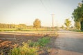 Farm road and snowcapped Mountain Rainier at background in Kent, Washington at sunset