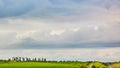 Farm silos at a distant farm at sunset. Royalty Free Stock Photo