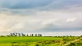 Farm silos at a distant farm at sunset. Royalty Free Stock Photo