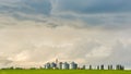 Farm silos at a distant farm at sunset. Royalty Free Stock Photo