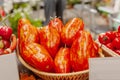 Farm tomatoes in a basket lie in the window of the farmer`s market. The latest hybrid varieties of vegetables Royalty Free Stock Photo