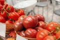 Farm tomatoes in a basket lie in the window of the farmer`s market. The latest hybrid varieties of vegetables Royalty Free Stock Photo