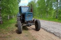 Farm tractor parked on the side of the road Royalty Free Stock Photo