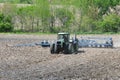 Farm tractor planting field with zero tillage