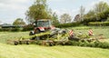 A farm tractor with rota rake ready to make silage Royalty Free Stock Photo