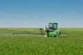 Farm Tractor Sprayer In Field