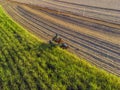 Farm Tractors working on sugar cane harvest plantation aerial view Royalty Free Stock Photo