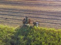 Farm Tractors working on sugar cane harvest plantation aerial view Royalty Free Stock Photo