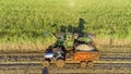 Farm Tractors working on sugar cane harvest plantation aerial view Royalty Free Stock Photo