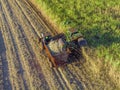 Farm Tractors working on sugar cane harvest plantation aerial view Royalty Free Stock Photo