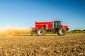 Farm Vehicle spreading lime onto a field