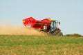 Farm Vehicle spreading lime sandstone onto a field Royalty Free Stock Photo