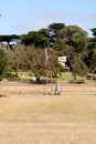 Farm windmill in outback Australia at Phillip Island Royalty Free Stock Photo